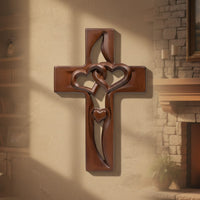 Hand-carved wooden wall decoration with a heart-shaped cross
